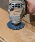 Heavy Duty Flap Abrasive Wheel For Grinder with 40 To 120 Mesh Grit on wood surface for rust and debris removal.