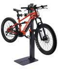 Electric Bike Repair Stand With 360 Degree Rotating Clamp Adjustable Height From 30 To 77 Inches 165 Lbs Capacity Tool Tray And Soft Pad Frame Protection Beefed Up Heavy Duty Bicycle Maintenance Stand For E Bikes And Mountain Bikes holding a mountain bike