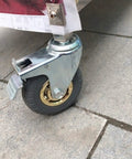 Heavy Duty Castor Wheels Set of 4 100mm Swivel Rubber Caster Wheels for Furniture Trolley M14x60mm with Brake on stone surface.