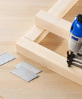 Using Sixteen Gauge Two Inch Angled Finish Nails Twenty Degree Offset Two Thousand Count Galvanized Steel in carpentry.