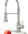 Rock Solid Brushed Nickel Kitchen Faucet With Pull Down Sprayer And 18.5 Inch High Arc Spout spraying water on apple.