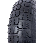 Detail of knobby ribbed rubber tire from No Sweet Glide 12 Inch Pneumatic Caster Wheels Set for heavy dollies.