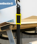 2 Inch Ratchet Strap Protectors For Trailer Tie Downs in use, showing protection on boat trailer with BoatBuckle model.