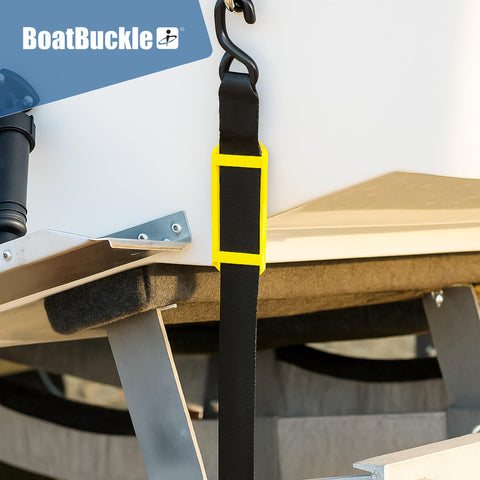 2 Inch Ratchet Strap Protectors For Trailer Tie Downs in use, showing protection on boat trailer with BoatBuckle model.