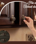 Hand touching Antique Brass Cabinet Knobs 10 Pack With Backplates on dark wood cabinet doors
