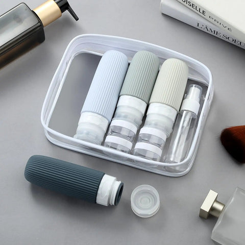 TSA Approved Travel Bottle Set With Leak Proof Silicone Squeezable Containers for Toiletries in clear zip case displayed on table