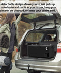 Black rolling cooler in car trunk, shown with open lid, ideal for outdoor parties, features bottle opener and drain plug.