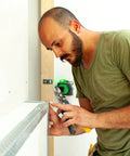 Person using Two Pack 1.5 Inch By 1.5 Inch Aluminum Angle 6063 T5 Built Tough Precision Extruded Architectural Trim for installation