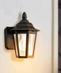 Classic black outdoor wall lantern with clear glass panels, ideal for wet locations, 10.25-inch high aluminum design.
