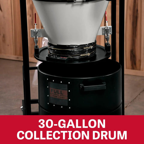 Two Stage Cyclone Dust Collector With 2 Micron Filter and 30-gallon drum in workshop setting