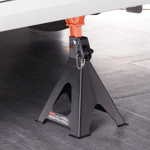 Pair of VEVOR 6-ton jack stands with black base and orange top clamp, adjustable height under vehicle.