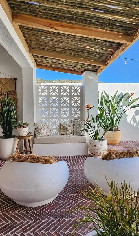 Outdoor patio with decorative wall using Windmill Breeze Brick Concrete Molds and Forms for Wall Decoration DIY Cement Furniture.