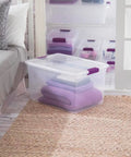 Heavy Duty Clear Plastic Storage Totes With Secure Snap Lock Lids 6 Pack 64 Quart Plus 6 Pack 66 Quart Stackable Bins with purple towels.