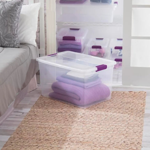 Heavy Duty Clear Plastic Storage Totes With Secure Snap Lock Lids 6 Pack 64 Quart Plus 6 Pack 66 Quart Stackable Bins with purple towels.