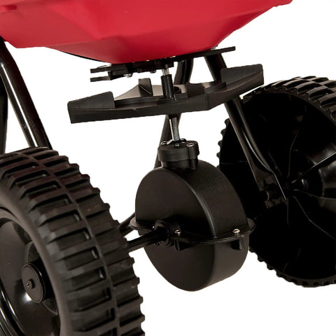 Close-up of Deluxe Heavy-Duty Walk-Behind Commercial Broadcast Spreader With 80 Lb Capacity showing poly tires and mechanism