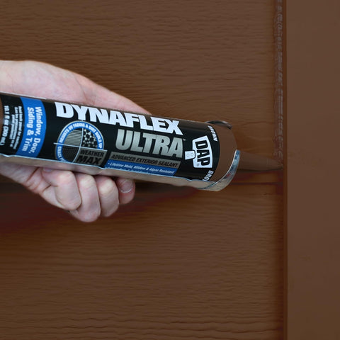 Applying Ultra Advanced Exterior Sealant With Weather Max Technology for windows, doors, siding, trim brown 10.1 oz with a caulk gun