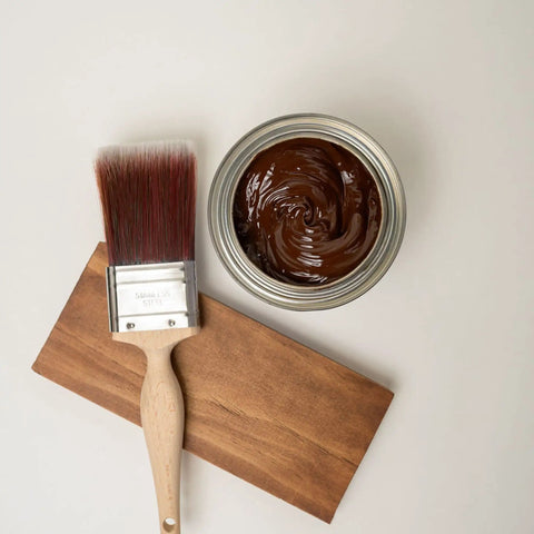 No Sweat Oil Base Gel Stain In Chestnut with a brush on a wooden surface, showing rich texture for DIY projects.