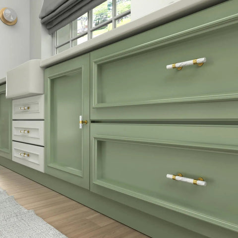 Ten Pack Center Mount Cabinet Knobs And Barrel Drawer Pulls In Matte Black With Gold Accents on green cabinetry.