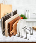 Super Sturdy Stainless Steel Pot Lid Organizer And Cutting Board Rack That Handles Bakeware Pots Pans Serving Trays And Storage Containers Directly Inside Kitchen with wooden and stainless steel boards.