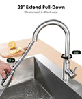 Premium Stainless Steel Pull Down Kitchen Faucet With Three Mode Spray Head being pulled down 23 inches over a sink.
