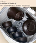 Tiny But Mighty Portable Mini Dishwasher With 360 Degree Directional Spray And Usb Battery For Countertop Scrubbing Plates Bowls And Produce Super Chill For Apartments Camping Rv And Dorms Zero Grease Headaches displaying brown teacups and bowls in a compact interior design.