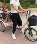 Hassle Free Fold Tandem Tricycle For Adults And Seniors With Rear Bucket Seat And Locking Safety Strap 20 Inch Front Wheel Heavy Duty Steel Frame Bright Pink Chill City Cruisers with two children riding.