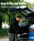 Man placing Ford F150 Windshield Sun Shade Custom Fit For 2021 To 2026 into trunk, showcasing foldable design.