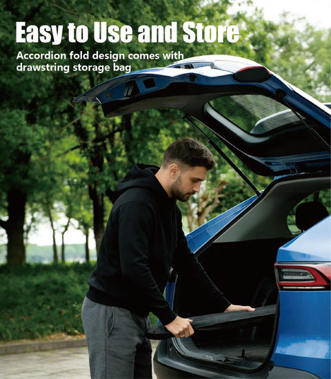 Man placing Ford F150 Windshield Sun Shade Custom Fit For 2021 To 2026 into trunk, showcasing foldable design.