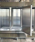 Professional Grade Commercial Stainless Steel Reach In Freezer With Three Roomy Solid Doors opened, showcasing spacious interior for storage.