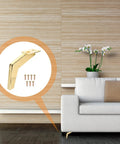 Sturdy Metal Furniture Feet Replacement Legs for Sofa, Cabinet, Coffee Table and More, in golden finish beside a sofa