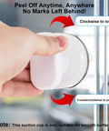 Hand installing 2 Pack Suction Cup Handles For Glass Surfaces And Smooth Walls No Drilling Required Installation on a glass door.