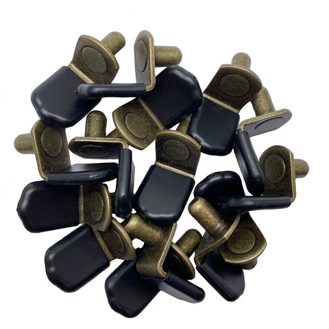 Glass Shelf Pegs In Bronze Tone Antique Bronze Finish For Cabinets Closets And Bookcases Bracket Style Pegs With Rubber Sleeve Six Millimeter One Quarter Inch Size Includes Thirty Pack. Close-up of bronze pegs with rubber sleeves in a pile, showing details and finish.