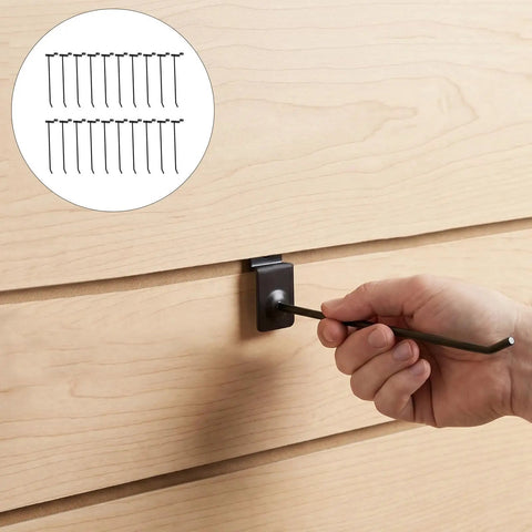 Hand installing 20 Pack Slat Wall Hooks For Slatboard Organizer Heavy Duty Iron Shelf Peg Hooks with 4mm rod thickness on wooden slatwall.