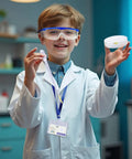 Child in Totally Fun Kids Science Costume Lab Coat Kit With Goggles ID Card Petri Dishes Dropper And Tweezers smiling in lab