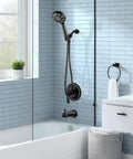 Sleek Matte Black Shower Faucet Set With Tub Spout And Valve in modern bathroom with black shower head and handheld