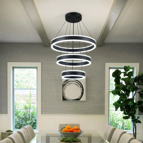 Modern Black LED Ring Chandelier With Three Adjustable Tiered Cylinders Hangs Flawlessly Over Kitchen Islands Or Bedrooms Quick Install Setup in a dining room.