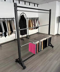 Heavy Duty Rolling Fabric Display Rack With Adjustable Cloth Roll Poles And Casters in retail space with cloth and vinyl storage.