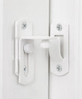 Four Pack Matte White 90 Degree Flip Barn Door Lock Latches Tough As Nails Heavy Duty Stainless Steel Gate Latch mounted on door.