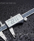 Close-up of IP54 Digital Caliper 0 To 6 Inches 150mm Stainless Steel With Large LCD Screen And Inch Metric Fractions Conversion Pro Grade Precision on wet surface