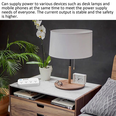Heavy Duty Smart Surge Protector Power Strip With Four Usb Ports For Fast Phone Charging And Ultra Tidy Home Office Outlet Organization Heavy Hitter Setup on a marble tabletop next to a lamp and plant.