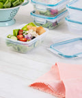 Total Solution Five Pack Three Cup Food Storage Containers With Leakproof Airtight Lids, filled with salad, shown in a kitchen setting
