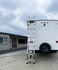 12.5 Foot Portable Aluminum Telescoping RV Ladder Heavy Duty, Rust Resistant, Fits Lippert On The Go Receiver, Easy Folding Design For Rooftop Access And Camp Life. Extended beside an RV.