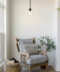 Industrial Pendant Light Fixture With Clear Glass Shade, Vintage Hanging Lighting For Kitchen Island, Dining Room, Hallway, And Bedroom, E26 Base UL Listed, Rustic Farmhouse Vibe Ceiling Light hanging above a wooden chair in a cozy corner.
