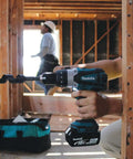 Hard Core Bad Boy 18V Cordless Hammer Driver Drill Kit Featuring 1/2 Inch Chuck And Two Speed Transmission in use, drilling into wood.