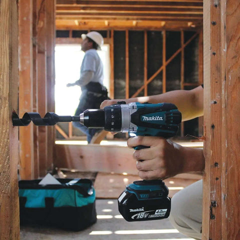 Hard Core Bad Boy 18V Cordless Hammer Driver Drill Kit Featuring 1/2 Inch Chuck And Two Speed Transmission in use, drilling into wood.