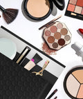 Image of 4 By 8 Inch Bubble Mailers 50 Pack Self Seal Waterproof Padded Envelopes with cosmetics and makeup brushes scattered around.