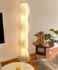 Dimmable Column Floor Lamp With Hula Skirt Shade, 55 Inch Tall Contemporary Standing Light in living room corner.