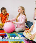 Children playing on Liquid Sensory Floor Tiles Set 11.8 Inch Square Multicolor For Kids Interactive Sensory Play With Floating Objects.