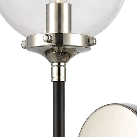 Close-up of One Light Matte Black Sconce With Clear Glass for Mid Century Modern Classic Vibe; steel and glass materials