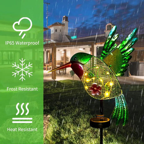 Outdoor Solar Hummingbird Garden Lights For Pathway And Patio metal stake light in rain, green and yellow LED glow, evening.